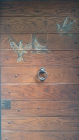 Doves on wooden door
